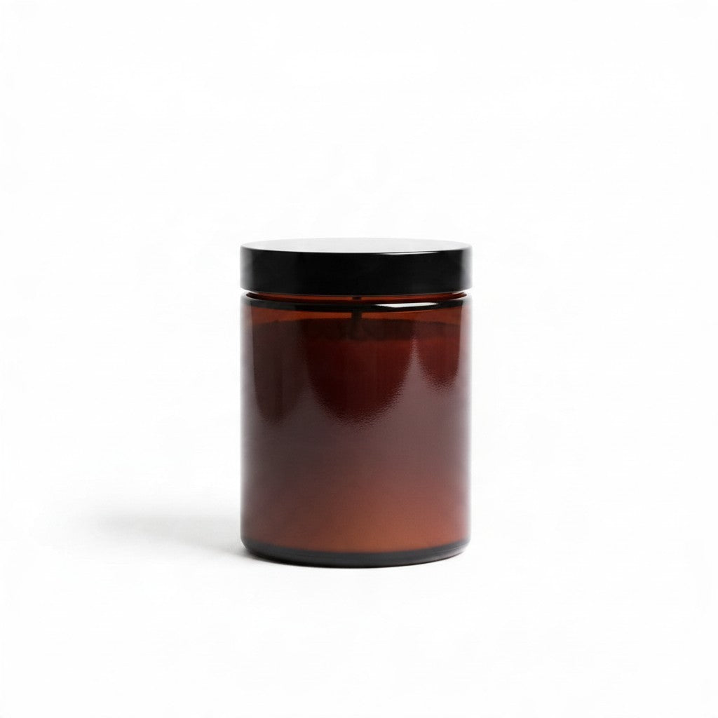 La Ferme Anglaise Belle Lumière hand-poured soy wax candle in a reusable amber glass jar with a black screw-top lid.