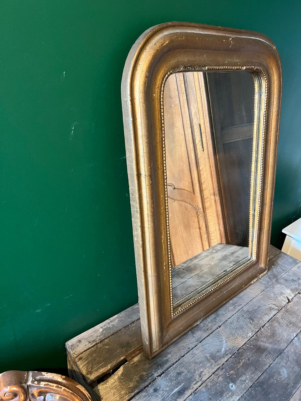 La Ferme Anglaise antique French Louis Philippe gilt mirror with a beaded border and aged foxed glass plate.