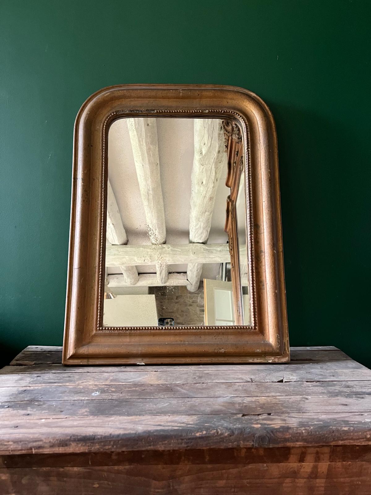 La Ferme Anglaise antique French Louis Philippe gilt mirror with a warm bronze-gold frame and beaded inner border.