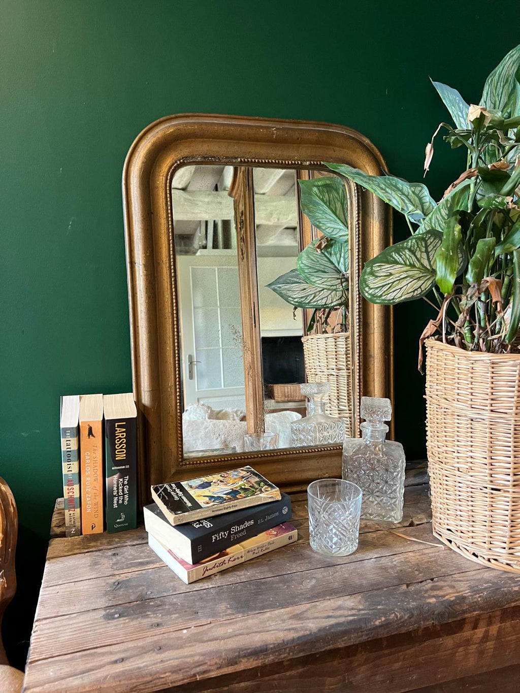 La Ferme Anglaise antique French Louis Philippe gilt mirror with beaded border on a rustic wooden table