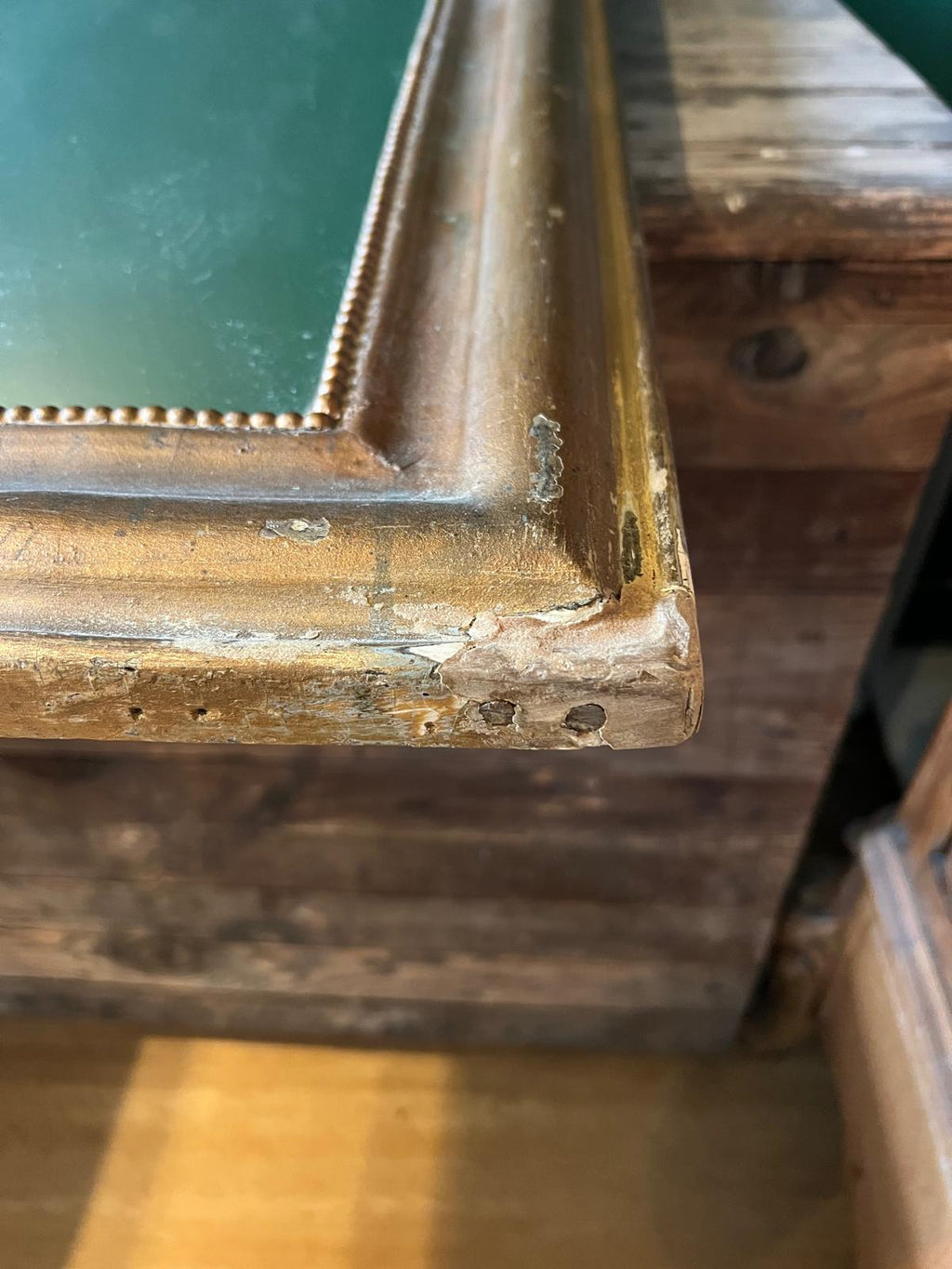 La Ferme Anglaise antique French Louis Philippe gilt mirror corner detail showing aged bronze-gold frame and beading