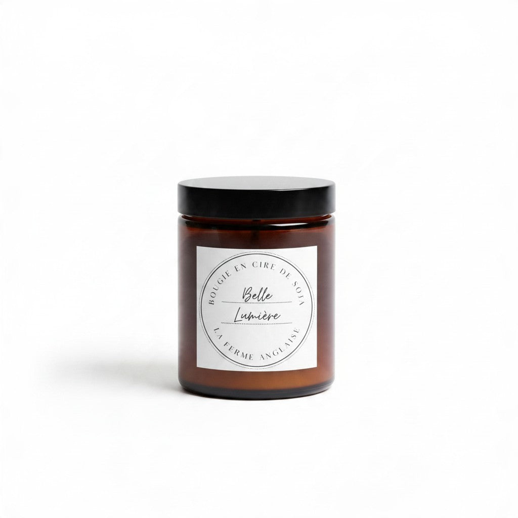 La Ferme Anglaise Belle Lumière hand-poured soy wax candle in an amber glass jar with a black screw-top lid.