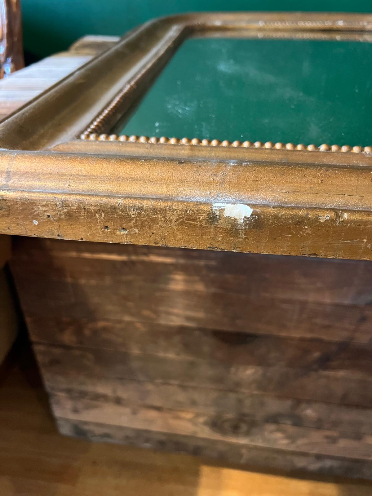 Close-up of La Ferme Anglaise antique French Louis Philippe gilt mirror frame showing beaded detail and gesso wear.