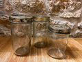 La Ferme Anglaise set of three vintage French glass storage jars with embossed Vereco and Familia Wiss metal lids.