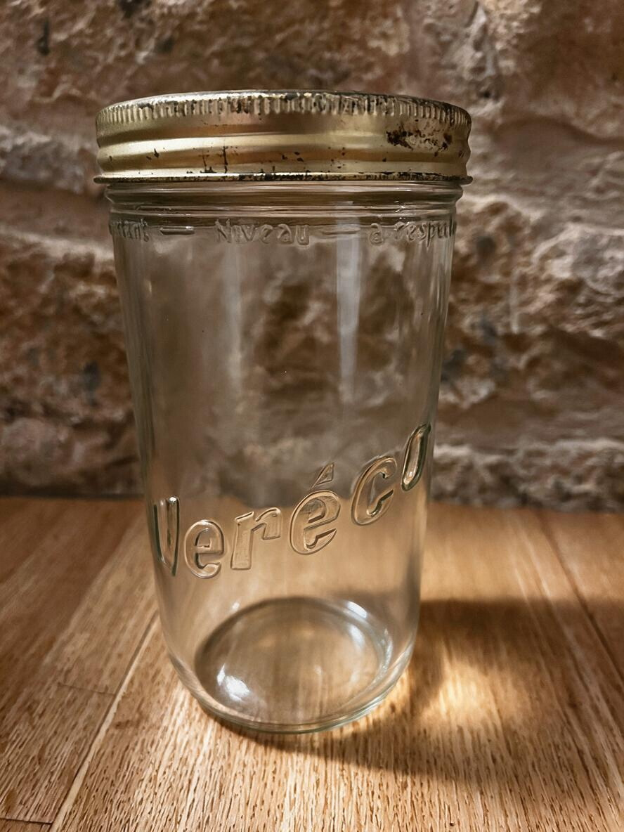 La Ferme Anglaise vintage Vereco French glass storage jar with a tarnished gold-tone metal screw lid